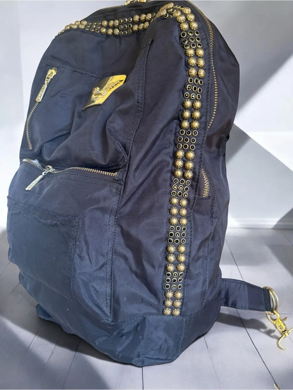 Jean Studded Backpack designed with an edgy  streetwear aesthetic.